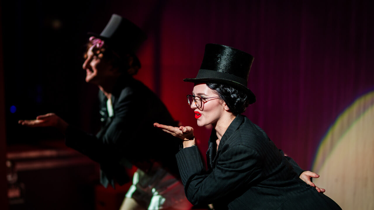 a female student actor preforming on stage
