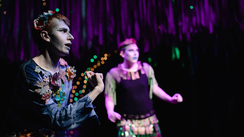Colorful costumed actors star in a scene from A Midsummer Night's Dream